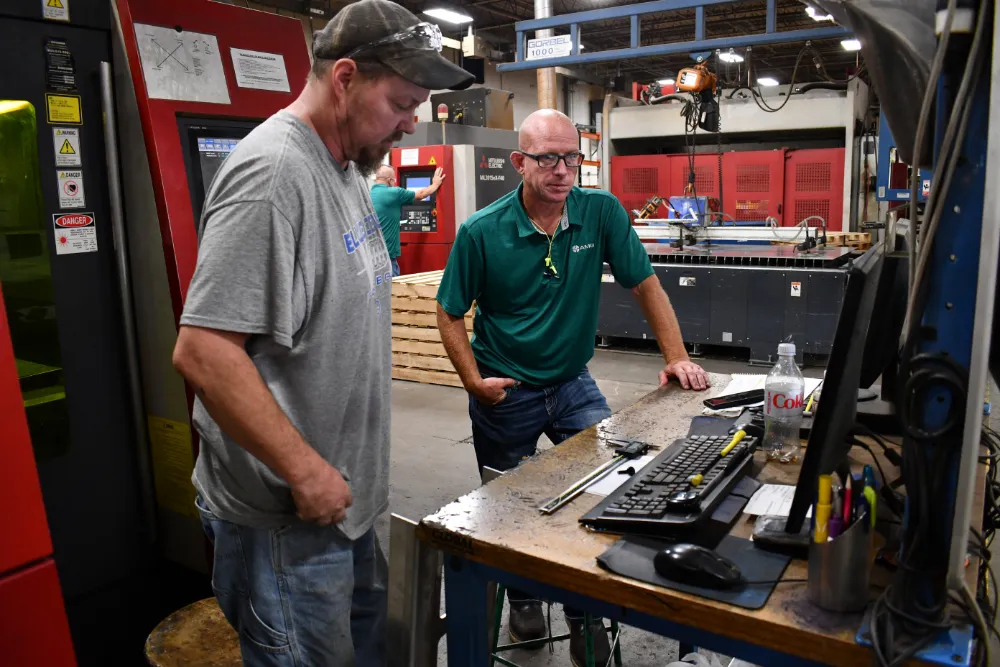 Engineers conducting quality inspection at AMG Industries